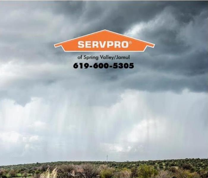 stormy sky with rain falling over desert 