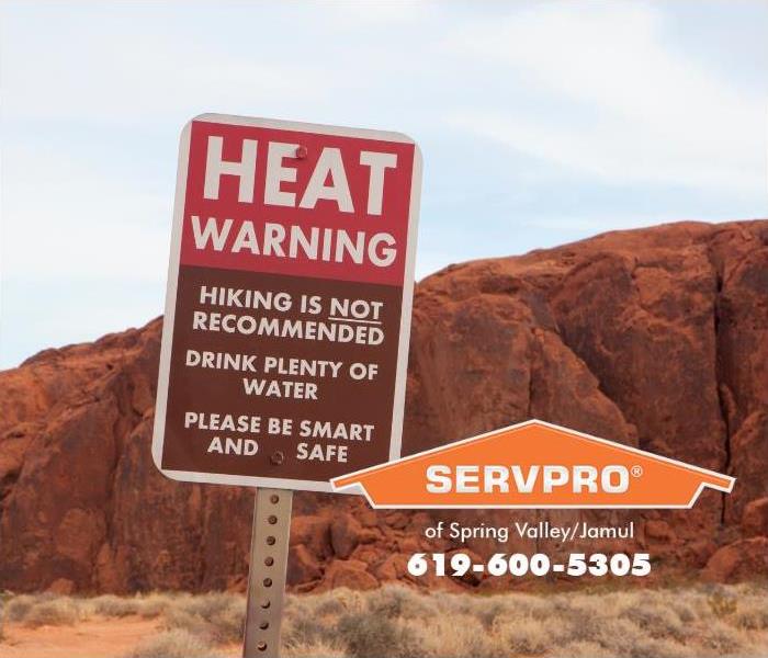 A heat advisory sign is shown. 