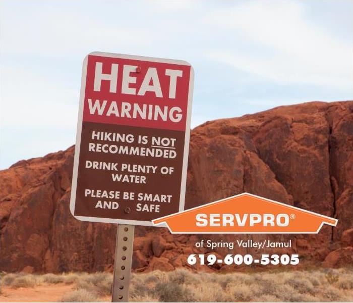 A heat advisory sign is shown. 